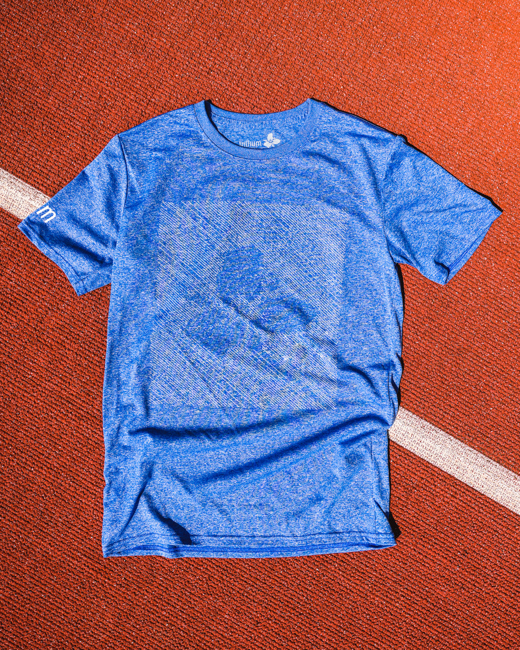 blue t-shirt with faded Trillium flower logo