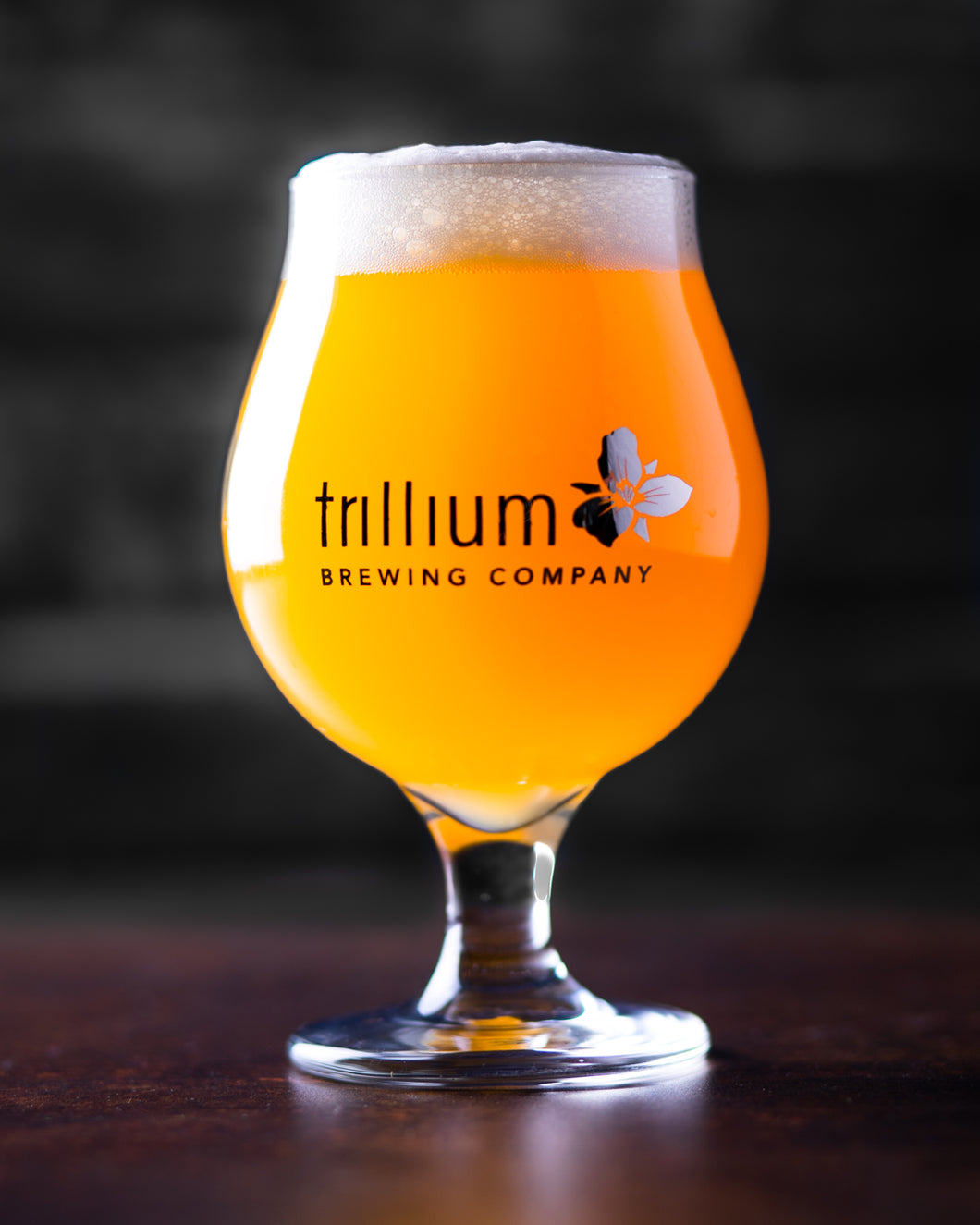 Clear Platinum Tulip glass filled with beer