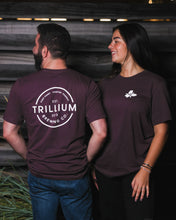 Load image into Gallery viewer, Male and Woman wearing maroon Trillium flower logo t-shirt
