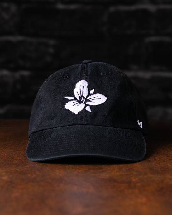Black Trillium 47' Fort Point Baseball cap with white floral embroidered Trillium flower logo